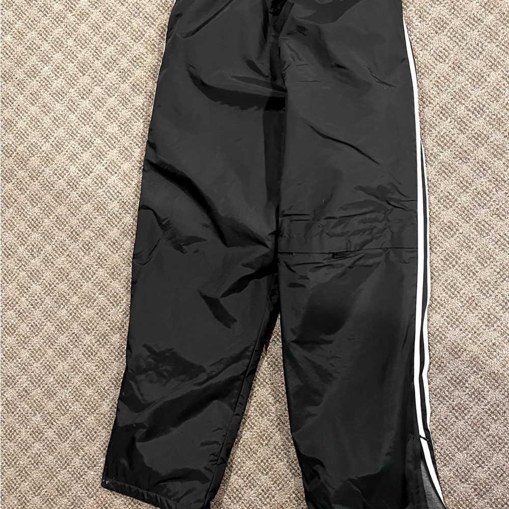 Ski/snow pants black with white stripe down legs. Size XL 14-16